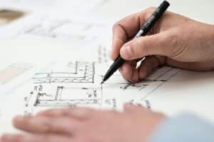 Picture of someone drawing a plan